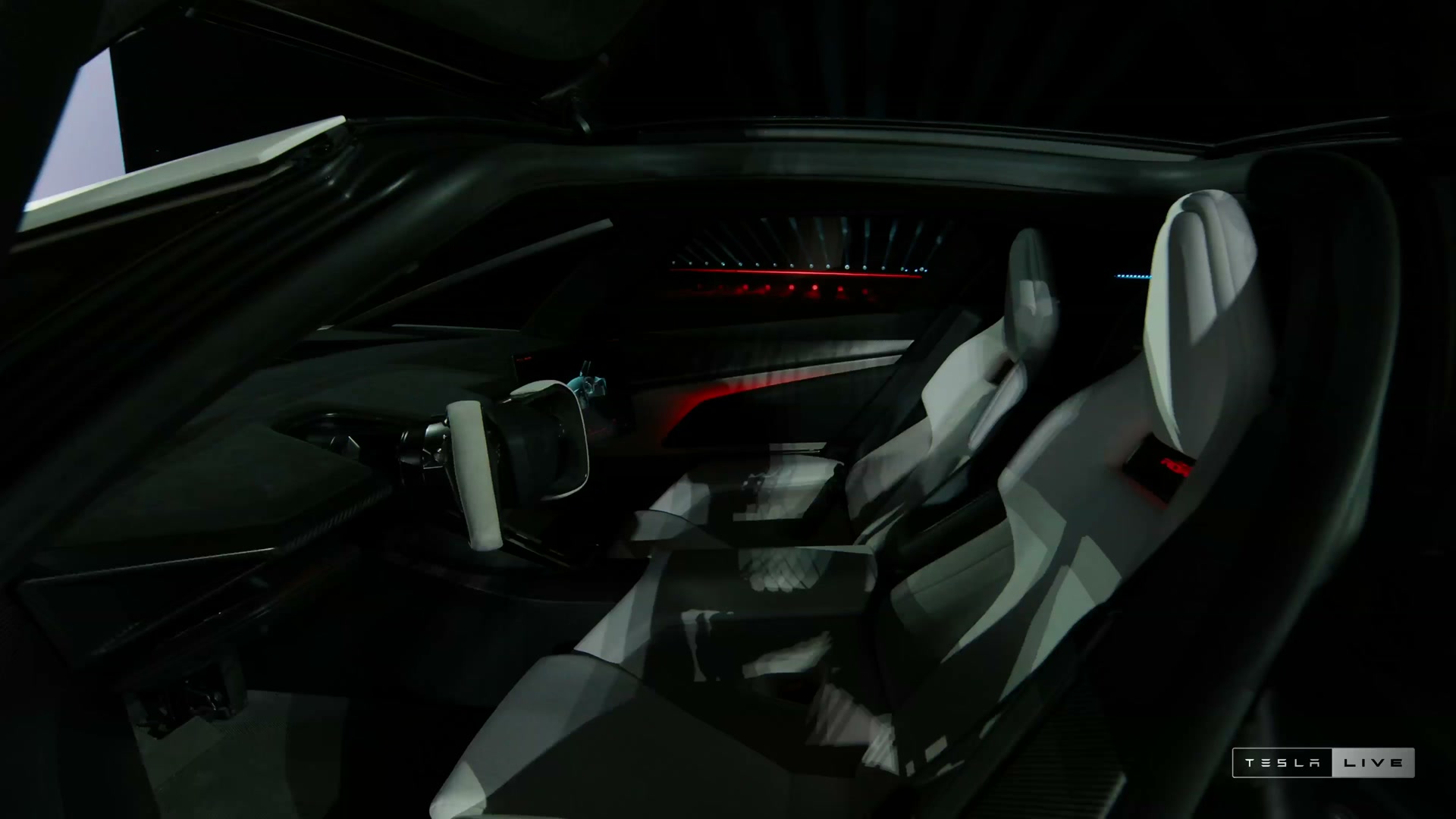 The two-seat cockpit, molded seats and steer-by-wire yoke shown in the recording.