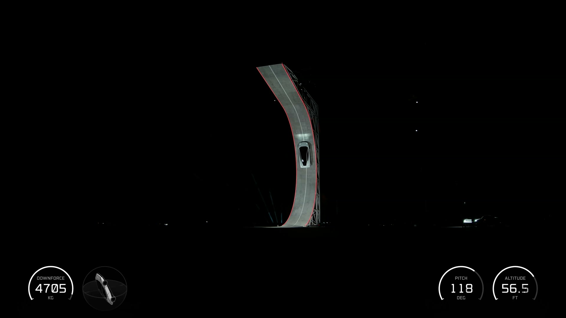 The vehicle climbs the curved structure during the suction-system demonstration.